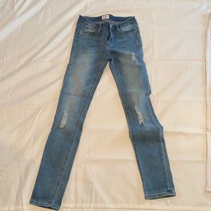 Hudson girls blue jeans with slight rip